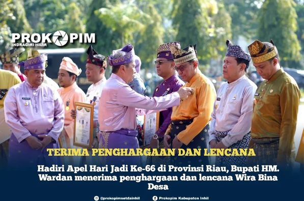 Hadiri Apel Hari Jadi Ke-66 di Provinsi Riau, Bupati HM. Wardan menerima penghargaan dan lencana Wira Bina Desa